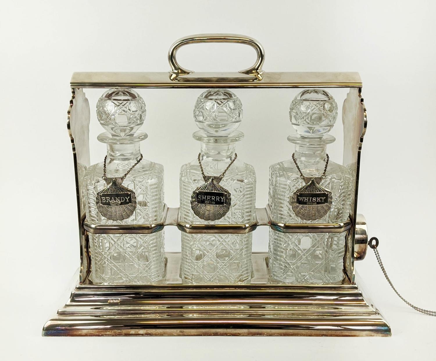 A WALKER AND HALL SILVER PLATED TANTALUS fitted with three square cut glass decanters, carrying - Image 11 of 11