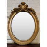 WALL MIRROR, 76cm W x 99cm H late 19th century French oval giltwood and gesso with floral and beaded