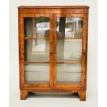 ART DECO DISPLAY CABINET, burr walnut with two glazed doors and shelves, 108cm H x 79cm W x 33cm D.