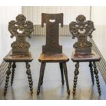 HALL CHAIRS, 98cm H x 38cm W, a pair, 19th century Continental ebonised pine with grotesque carved