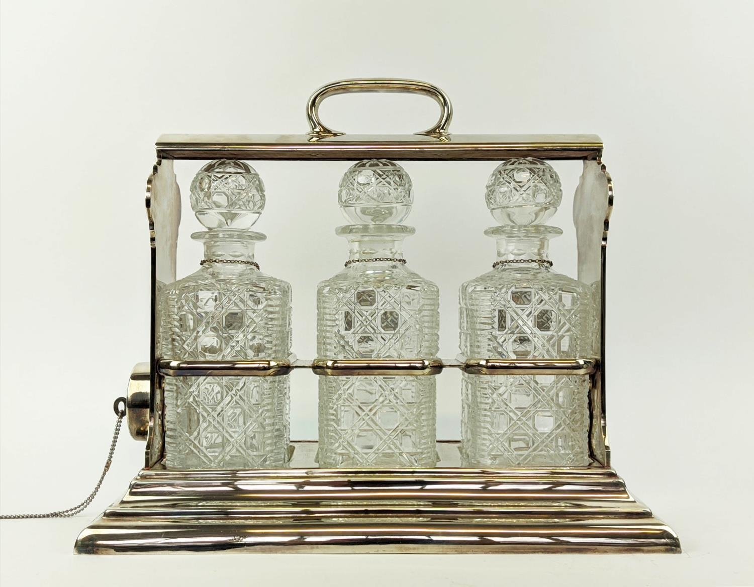 A WALKER AND HALL SILVER PLATED TANTALUS fitted with three square cut glass decanters, carrying - Image 10 of 11