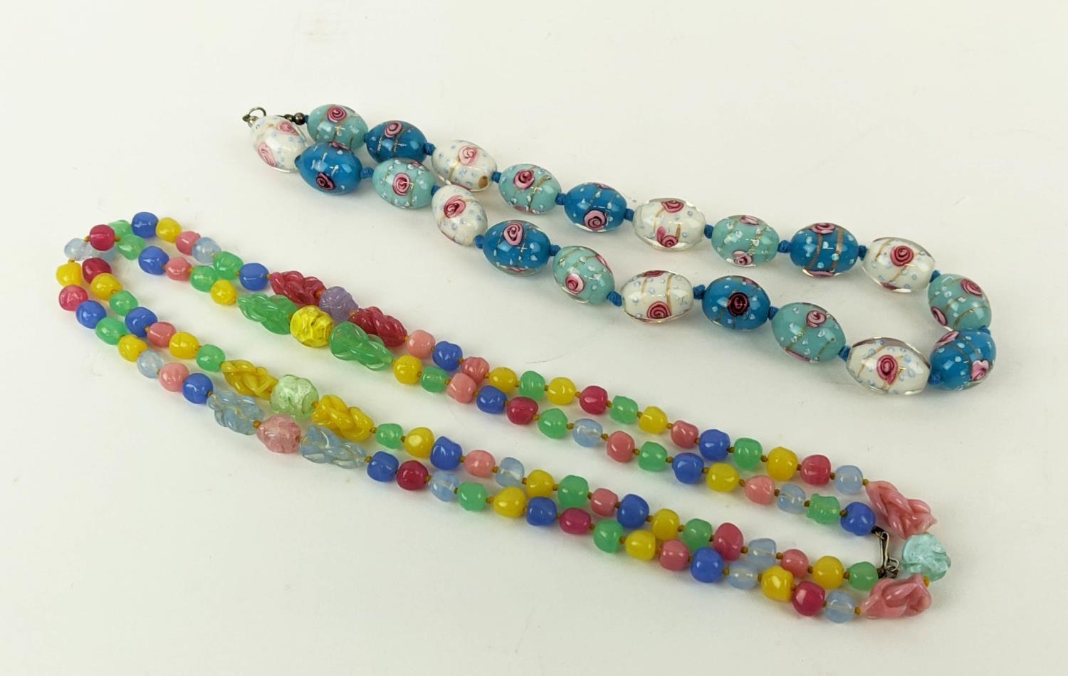 VENETIAN GLASS NECKLACES, one made from decoratively coloured oval beads, rose motifs, silver clasp,