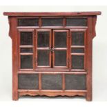 CHINESE CABINET, 19th century scarlet firwood framed enclosing faint gilt decorated black lacquer