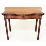 TEA TABLE, George III figured mahogany of serpentine outline, carved edge, and fold over top, 91cm W