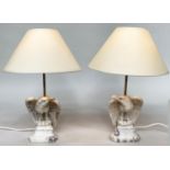 TABLE LAMPS, a pair, carved marble in the form of eagles on plinths, 50cm H. (2)