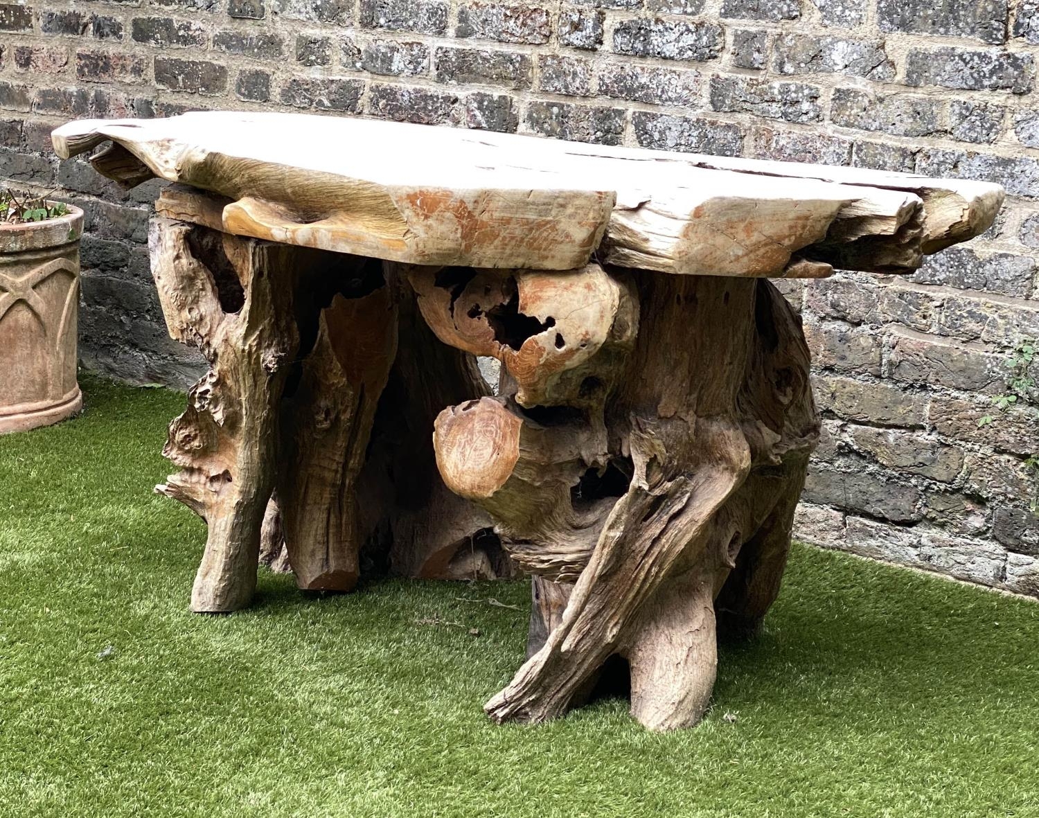GARDEN 'ROOT' TABLE, well weathered tree section with raw edge and knarled root base, 136cm W x 66cm - Image 2 of 4