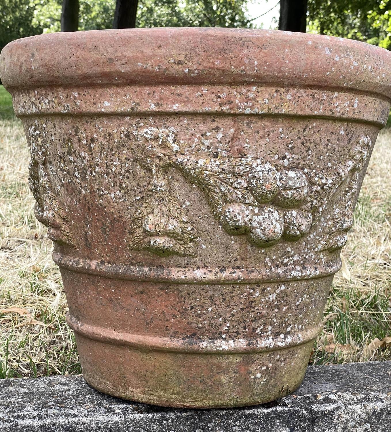 GARDEN TERRACOTTA PLANTERS, a set of three, large weathered terracotta with fruit decoration, 57cm W - Image 8 of 8