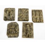 PANELS, a set of five, inspired by the Benin bronze panels in the British Museum, carved wood,