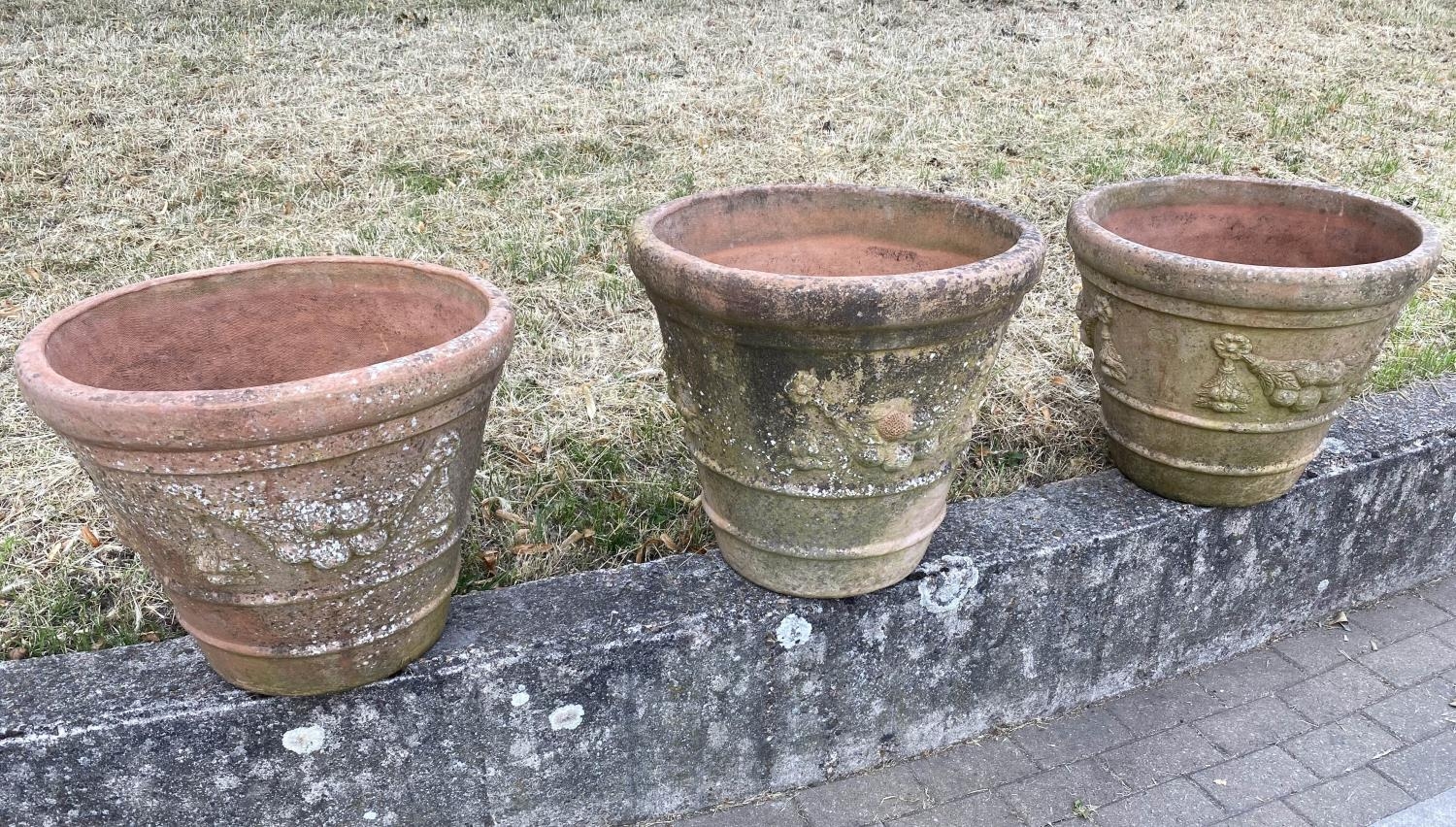 GARDEN TERRACOTTA PLANTERS, a set of three, large weathered terracotta with fruit decoration, 57cm W - Image 2 of 8