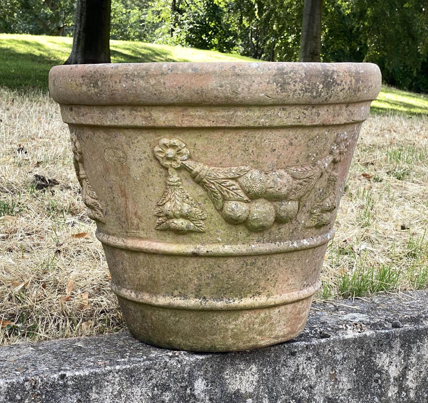 GARDEN TERRACOTTA PLANTERS, a set of three, large weathered terracotta with fruit decoration, 57cm W - Image 7 of 8