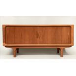 DYRLUND SIDEBOARD, 1970s teak with two stitching doors enclosing baize lined trays and shelf,