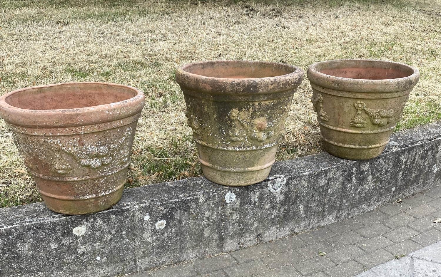 GARDEN TERRACOTTA PLANTERS, a set of three, large weathered terracotta with fruit decoration, 57cm W - Image 4 of 8