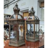 STORM LANTERNS, a pair, 69cm H, aged metal and glazed.