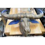 WATER BUFFALO, carved wood with brass cladding and lapis lazuli ears, eyes and horns, 145cm W x
