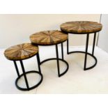 NEST OF TABLES, graduated set of three, largest measuring 46cm high, 45cm diameter, metal bases. (3)