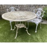 GARDEN TABLE AND CHAIRS, weathered painted cast aluminium circular pierced with two matching chairs,