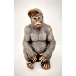 GORILLA WEARING A BASEBALL CAP, 60cm H x 40cm W x 34cm D, faux bronze finish resin.