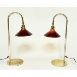 DESK LAMPS, a pair, arched tubular brass with circular bases and conical glass shades, 70cm H. (2)
