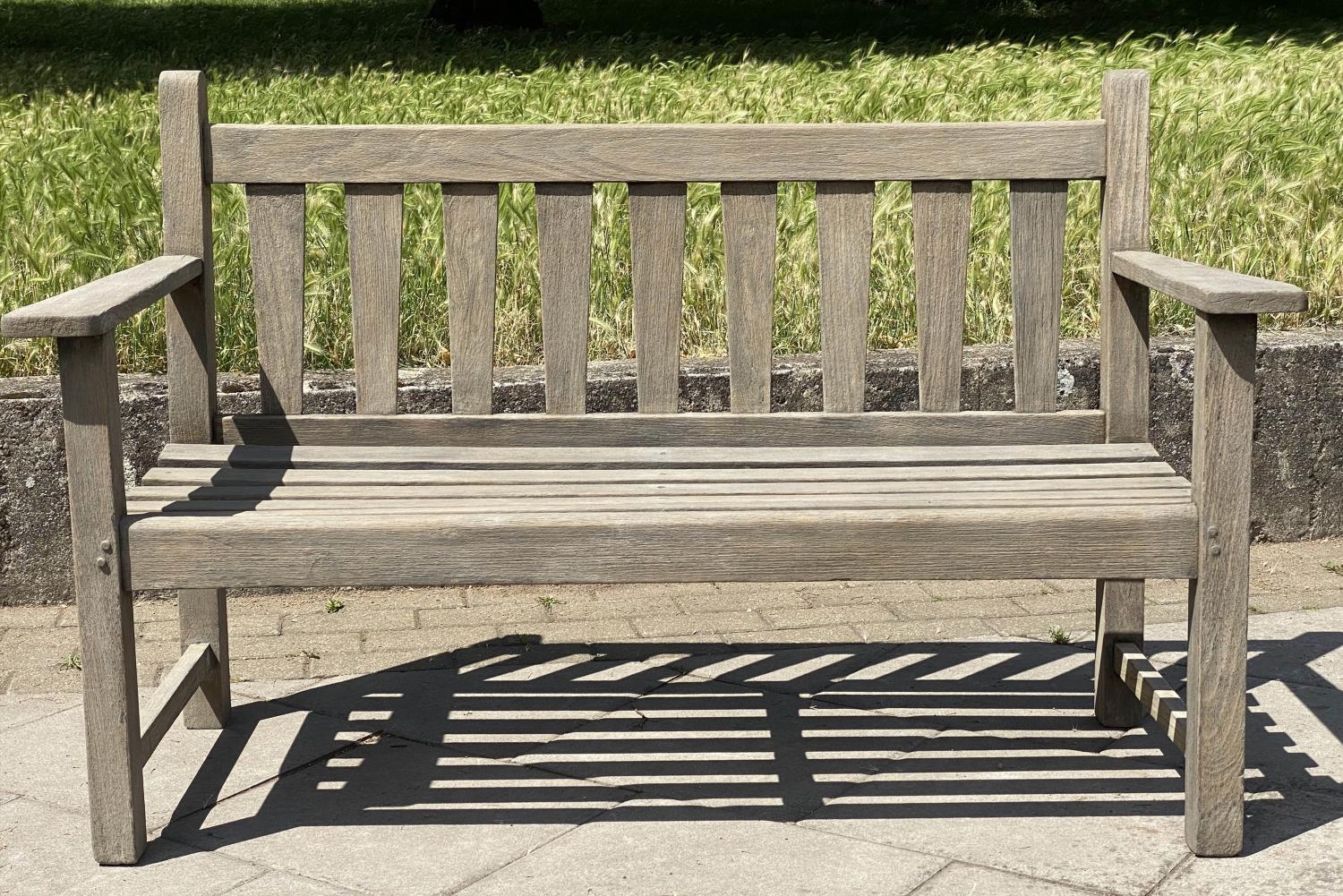 GARDEN BENCH, weathered teak with triangular splat back, 140cm W.