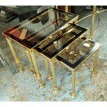NEST OF TABLES, a set of three, 1960s French style, gilt metal and glass, 55.5cm x 33.5cm x 48cm. (