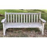 'LISTER GARDEN BENCH, well weathered teak slatted with broad flat top arms, 162cm W.