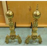 FIRE DOGS, a pair, 59cm H brass, each with turned finials, an orb shaped top and lion mask