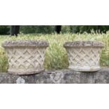 GARDEN PLANTERS, a pair, well weathered reconstituted stone, circular with basket weave sides and