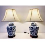 TABLE LAMPS, 60cm H x 40cm diam., a pair, Chinese Export style blue and white ceramic, with cream