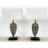 TABLE LAMPS, a pair, African Tribal mask design, with shades, 49cm H. (2)