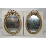 WALL MIRRORS, a pair, Louis XVI style, applied to later boards, painted finish, 19th century oval