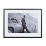 SEAN CONNERY AS JAMES BOND WITH ASTON MARTIN, photographic print, framed and glazed, 63cm x 83cm.