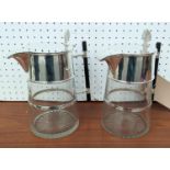 CHRISTOPHER DRESSER STYLE CLARET JUGS, pair, silver plated and glass bodies, 21cm H. (2)
