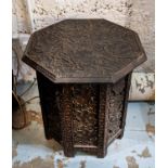 OCCASIONAL TABLE, Anglo-Indian octagonal form, foliage carved top and pierced folding base, 49cm H x