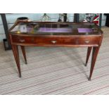 BIJOUTERIE TABLE, 115cm W x 76cm H x 47cm D Art Deco manner with a glass top above three drawers