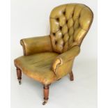 LIBRARY ARMCHAIR, Edwardian mahogany with brass studded and deep buttoned green leather upholstery