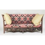 'KELIM' SOFA, late 19th/early 20th century carved oak with kelim style upholstery and pierced
