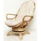 TERRACE/VERANDAH ARMCHAIR, mid 20th century rattan framed and cane bound revolving and reclining (