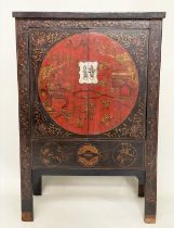 MARRIAGE CABINET, early 20th century Chinese lacquered and gilt Chinoiserie decorated with two doors