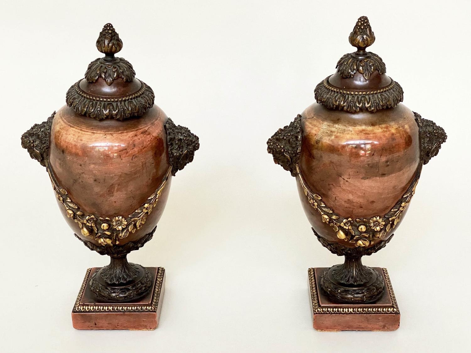 JASPER URNS, a pair, 19th century gilt bronze mounted with finials, fixed top covers and swags, 29cm