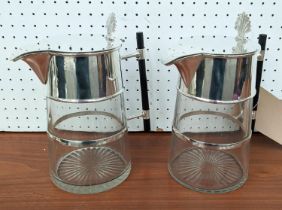 CHRISTOPHER DRESSER STYLE CLARET JUGS, pair, silver plated and glass bodies, 21cm H. (2)