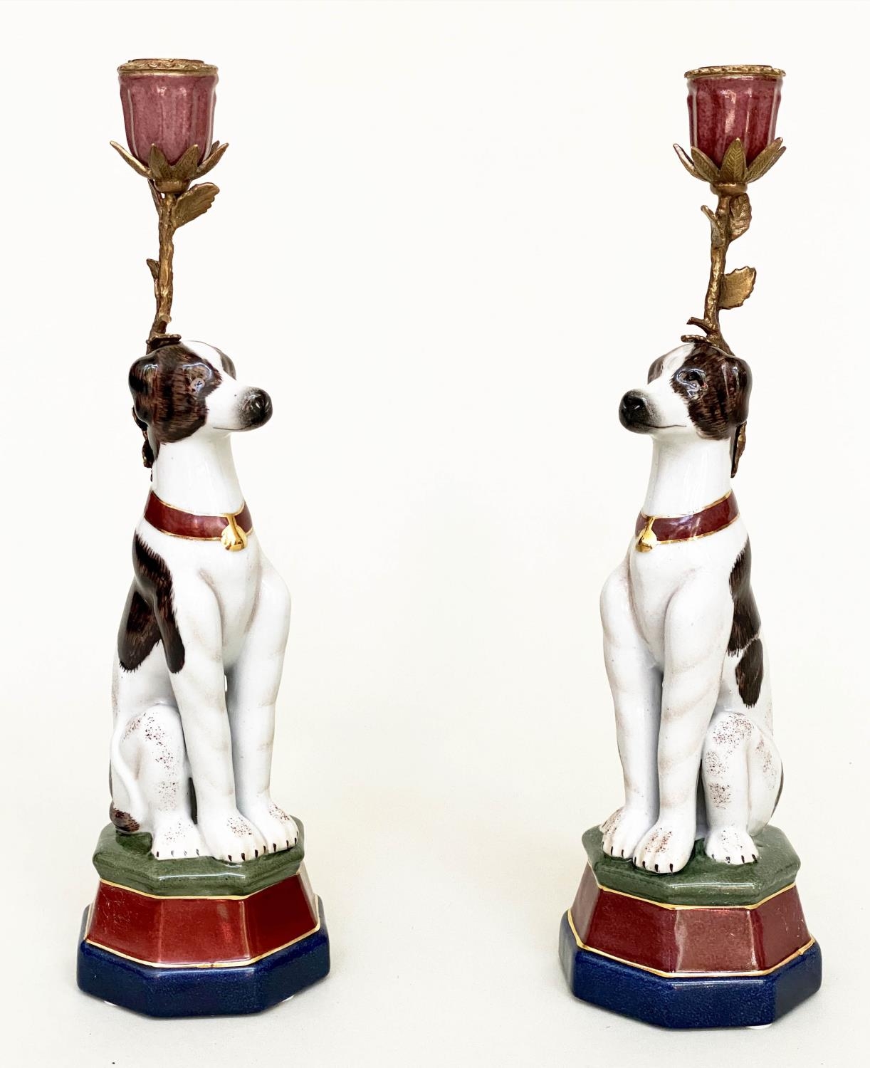 'DOG' CANDLESTICKS, a pair, Continental style painted porcelain and gilt metal mounted, 35cm H. (2)