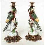 PARROTT CANDLESTICKS, a pair, 36cm H, Continental style, painted porcelain, with gilt metal