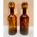 DECANTERS, a pair, 53cm H x 14cm diam., Murano style tortoiseshell glass. (2)
