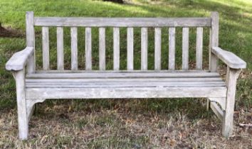 LISTER GARDEN BENCH, well weathered teak slatted with broad flat top arms, 162cm W.