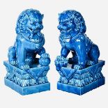 FOO DOGS, a pair, 39cm high, 15cm wide, 25cm deep, glazed ceramic. (2)