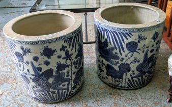 PLANTERS, a pair, 50cm high, 48cm diameter, Chinese export style blue and white ceramic. (2)