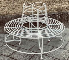 GARDEN TREE BENCH, painted wrought iron of slatted concentric form with scroll decoration in two