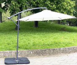 CANTILEVER GARDEN PARASOL, circular cream canvas retractable 'winder action', with weighted (