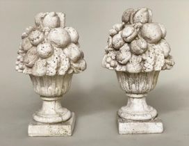 GARDEN FINIALS, a pair, weathered reconstituted stone modelled as cornucopia/fruit, 50cm H. (2)