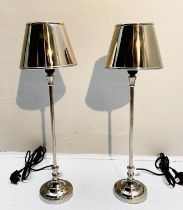 LIBRARY TABLE LAMPS, a pair, 64cm H x 20cm diam., polished metal, with shades. (2)